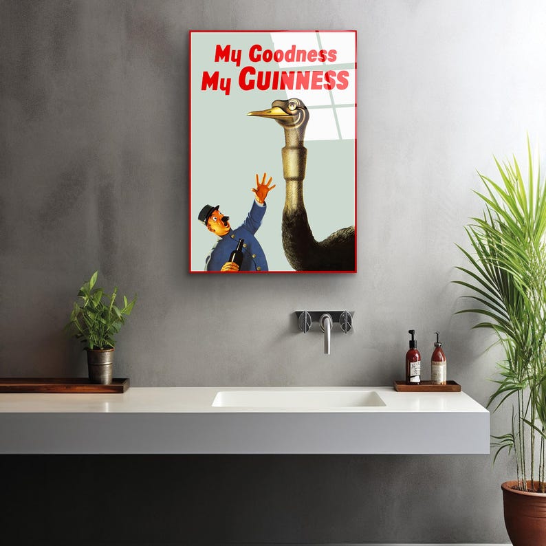 May include: A vintage poster advertising Guinness beer. The poster features a cartoon illustration of a man reaching out to a large ostrich with the text "My Goodness My GUINNESS" in red and white.