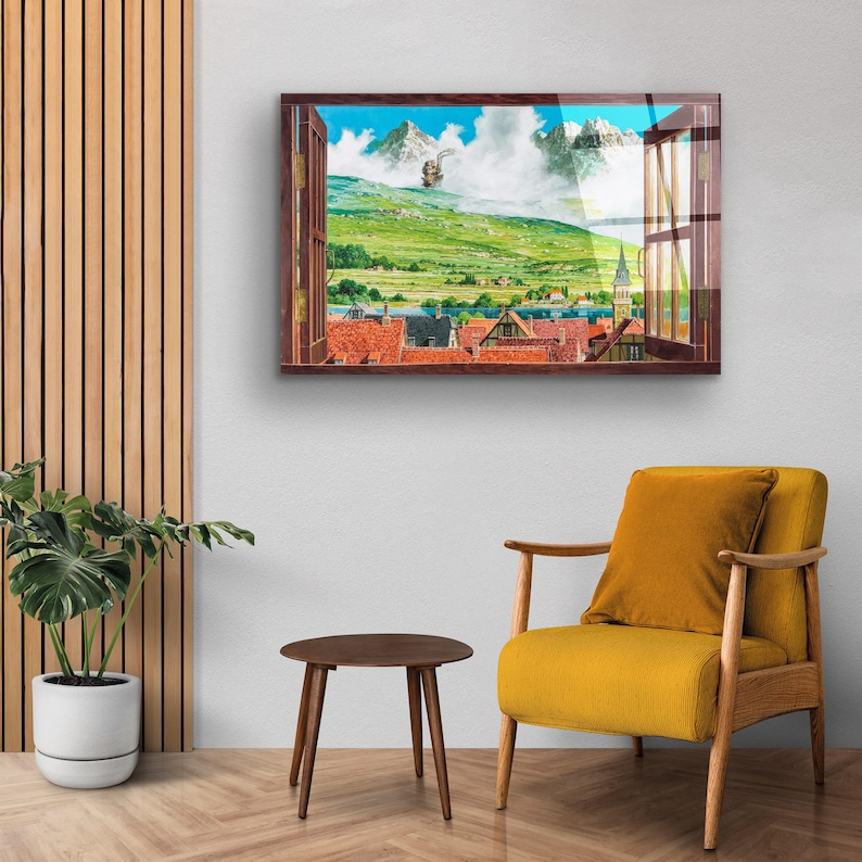 May include: A framed print of a window view with a mountain landscape and a small town in the distance. The window is open and the view is framed by a wooden window frame.