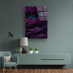 May include: Abstract art print featuring a vibrant display of colors. The artwork showcases a dynamic composition of purple, magenta, and teal hues, creating a visually striking and textured effect. The piece is mounted on a wall, adding a modern touch to the room's decor.