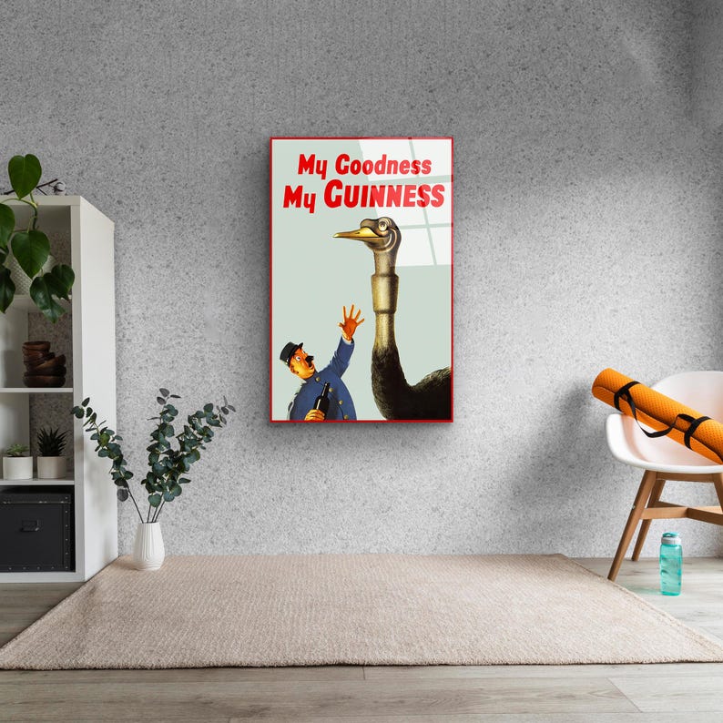 May include: A vintage Guinness advertisement featuring a man in a blue uniform reaching out to a large ostrich with the text "My Goodness My GUINNESS".