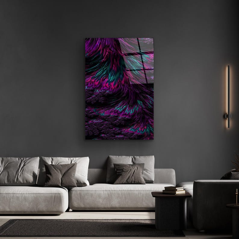 May include: Abstract wall art featuring a vibrant display of colors. The artwork showcases a blend of purple, teal, and pink hues, creating a dynamic and visually appealing composition. The piece is mounted on a dark gray wall, enhancing the artwork's vivid colors.