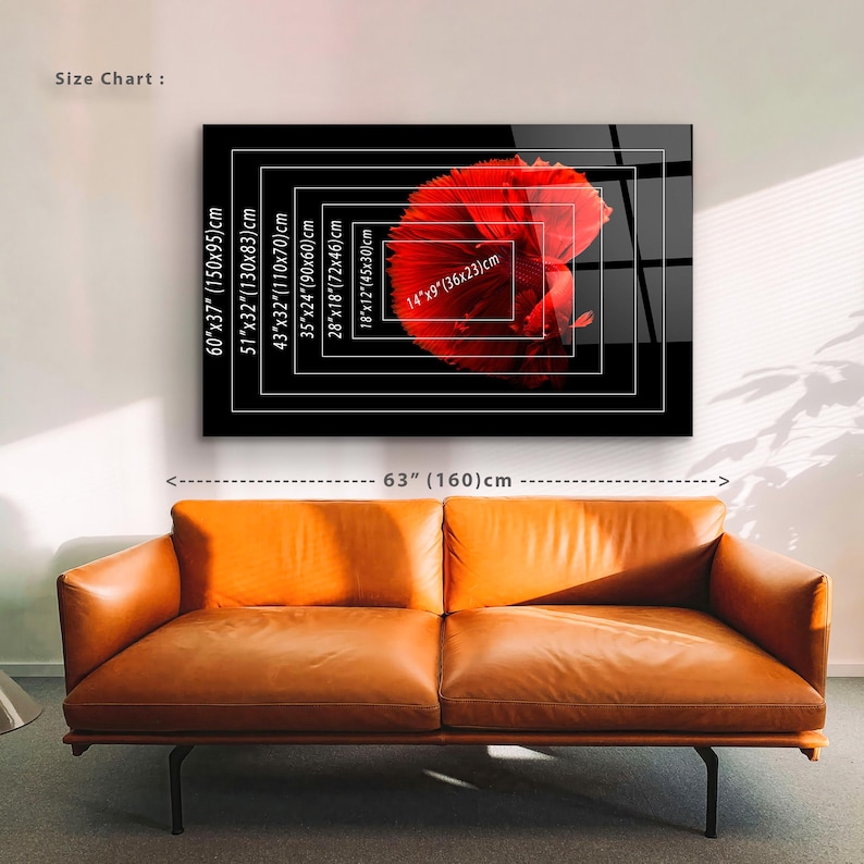 May include: A red betta fish art print on a black background, with a size chart showing dimensions in inches and centimeters. The print is displayed above a brown leather sofa. The image is 63 inches (160 cm) wide.