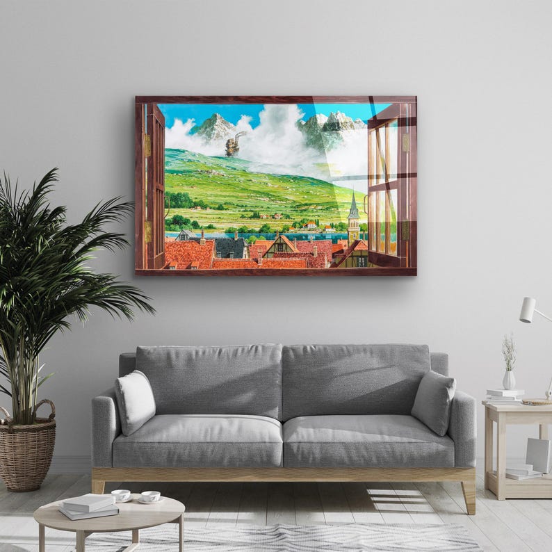 May include: A framed print of a window view with a green landscape, a small town, and a flying ship in the distance. The window frame is brown wood.