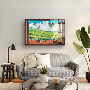 May include: A framed print of a window view with a cityscape and mountains in the distance. The window is open and the view is framed by a wooden window frame. The print is in a brown frame and is hanging on a white wall.