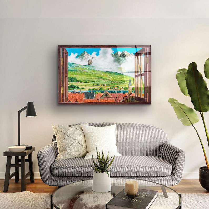 May include: A framed print of a window view with a cityscape and mountains in the distance. The window is open and the view is framed by a wooden window frame. The print is in a brown frame and is hanging on a white wall.