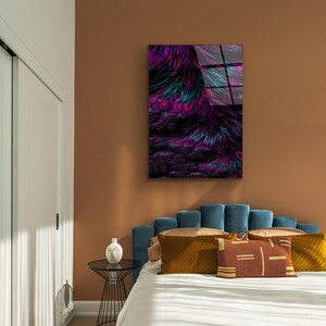 May include: Abstract art print featuring a vibrant display of colors. The artwork showcases a blend of purple, teal, and black hues, creating a dynamic and textured visual effect. The piece is mounted on a wall, adding a modern touch to the room's decor.