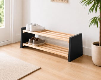 Banco zapatero para recibidor, banco de listones de madera con laterales trapezoidales negros, almacenamiento minimalista para zapatos de pasillo.