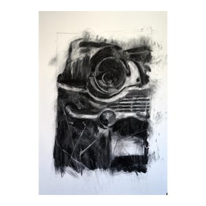 May include: A charcoal drawing depicting the front of a classic car, highlighting the headlights, grille, and bumper. The artwork is in black and grey, with visible brushstrokes and a textured finish. The drawing is set against a white backdrop.