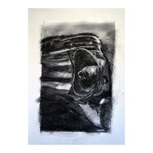 May include: A black and white charcoal drawing of a car's headlight. The drawing is done in a realistic style and captures the details of the headlight, including the glass, the metal housing, and the reflector.