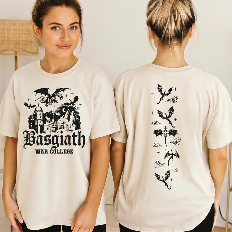 A woman wearing a white t-shirt with a graphic design featuring a castle and dragons.