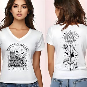 A woman wearing a white t-shirt with a graphic design on the front and back.