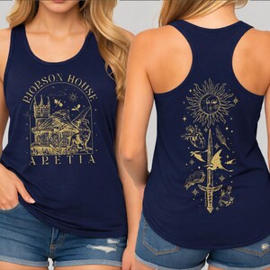 a woman wearing a navy blue tank top with a gold design on the front and back.