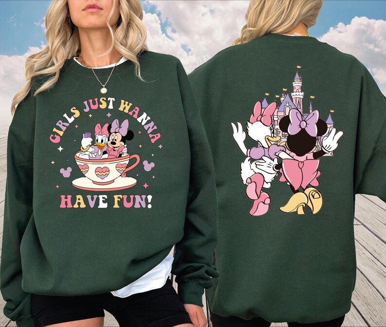 a woman wearing a sweatshirt with minnie mouse on it