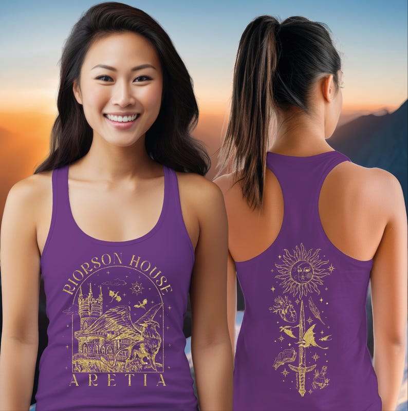 A smiling woman wearing a purple tank top with a graphic design on the front and back.