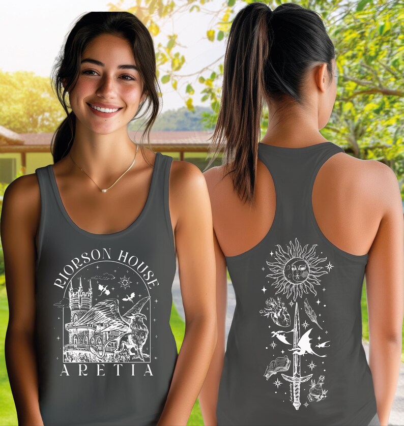 A woman wearing a gray tank top with a graphic design on the front and back.