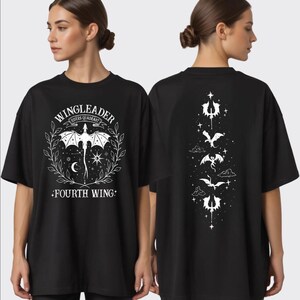 A woman wearing a black t-shirt with a graphic design featuring a dragon and the text "WINGLEADER" and "FOURTH WING".
