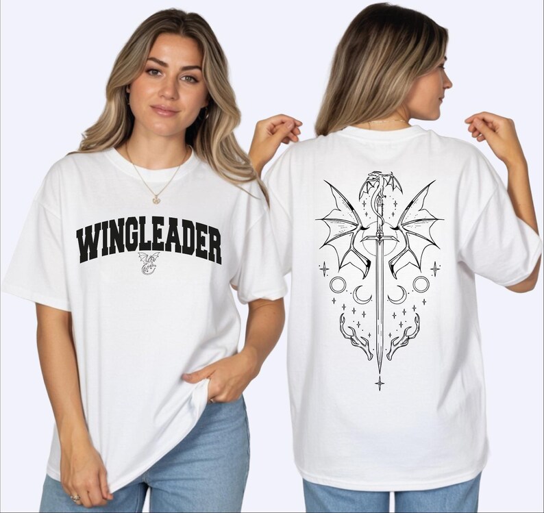 A woman wearing a white t-shirt with the text "WINGLEADER" printed on it, posing with her back to the camera.