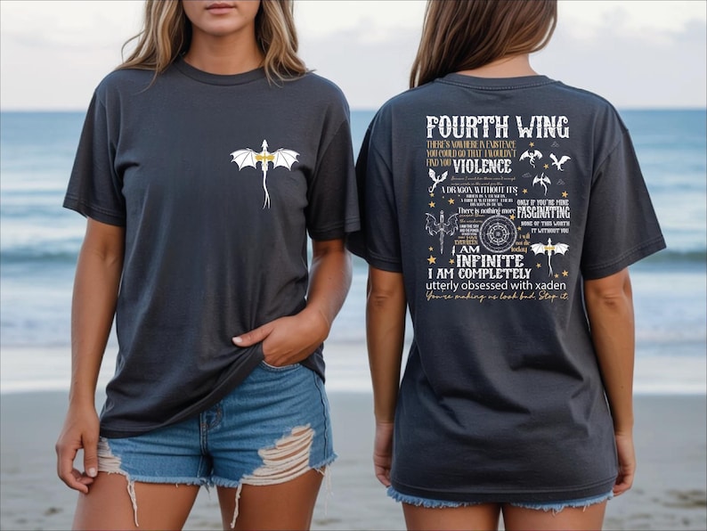 a woman wearing a black t-shirt with a graphic design and text on the back.