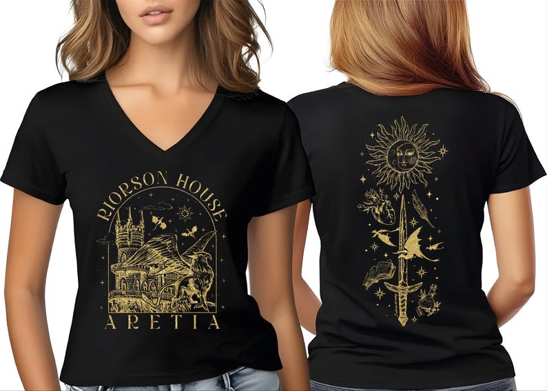 A woman wearing a black t-shirt with a gold graphic design on the front and back.