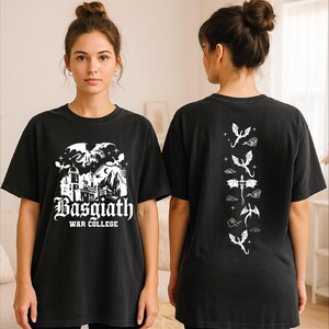 A woman wearing a black t-shirt with a graphic design featuring a castle and dragons.