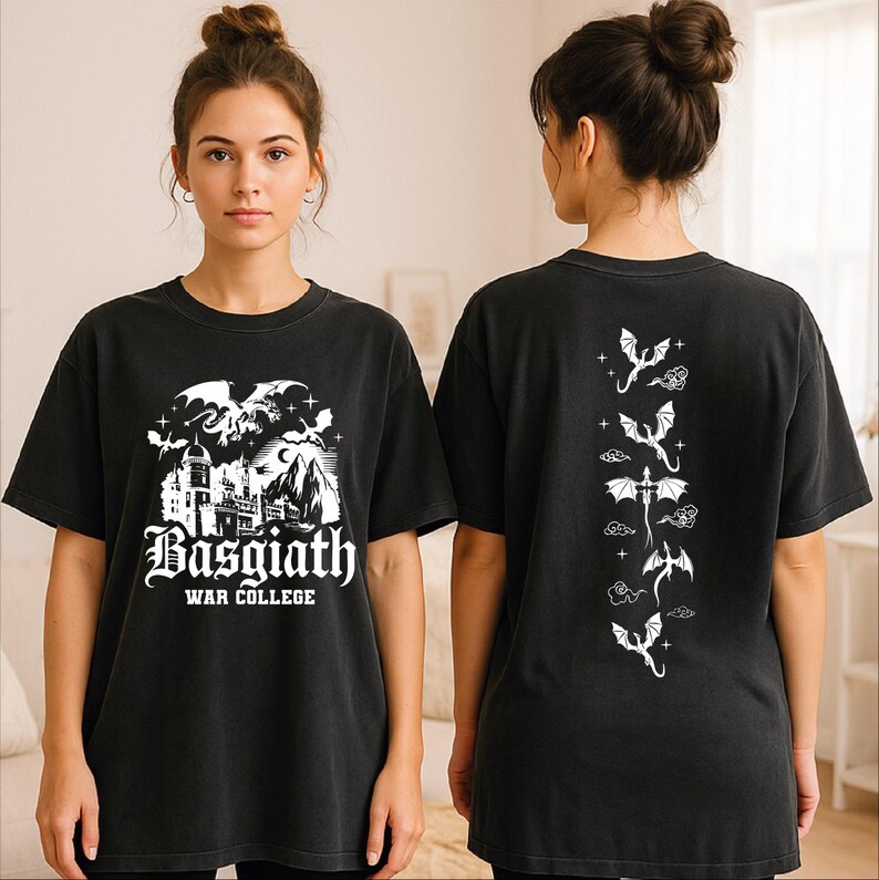 A woman wearing a black t-shirt with a graphic design featuring a castle and dragons.