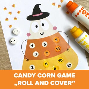 Op de afbeelding: Een Halloween-spel met een candy corn-ontwerp met de nummers 1-12. De afbeelding bevat dobbelstenen en stiften met de tekst "orange" en "yellow". De tekst "CANDY CORN GAME, ROLL AND COVER" staat onderaan.