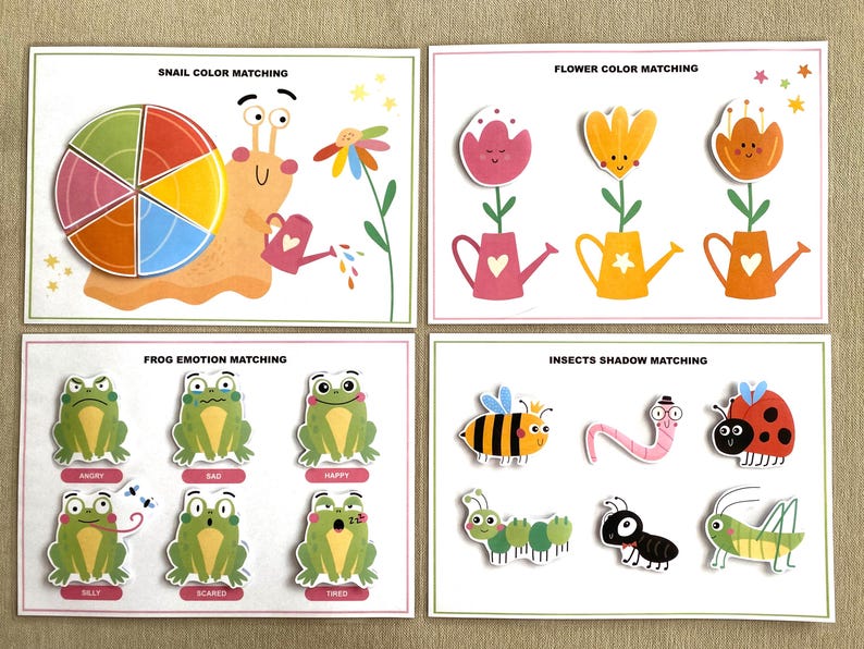 K&ouml;nnte beinhalten: Vier druckbare Aktivit&auml;tskarten f&uuml;r Kinder mit Zuordnungsspielen. Die Karten beinhalten ein Schnecken-Farbzuordnungsspiel, ein Blumen-Farbzuordnungsspiel, ein Frosch-Emotionszuordnungsspiel und ein Insekten-Schattenzuordnungsspiel.