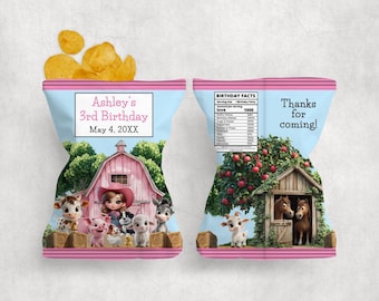 May include: A light blue crisp packet with a pink top and bottom, featuring a farm scene with cartoon animals and a pink barn. The packet has text that reads "Ashley's 3rd Birthday" and "May 4, 20XX".