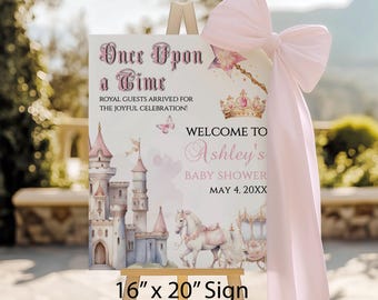 Puede incluir: Un letrero sobre un caballete con el texto "Once Upon a Time" y "Welcome to Ashley's Baby Shower". El letrero presenta una ilustración de un castillo, un carruaje tirado por caballos y un lazo rosa. El letrero mide 40,6 cm x 50,8 cm.