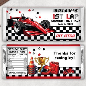 May include: Two chocolate bar wrappers with a racing theme. One wrapper features a red race car, the text "BRIAN'S 1ST LAP AROUND THE TRACK," and a checkered flag design. The other wrapper says "BIRTHDAY PARTY" and "Thanks for racing by!"