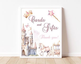 Puede incluir: Un cartel blanco con un castillo rosa, una corona dorada, una varita rosa y el texto "Tarjetas y regalos ¡Gracias!"