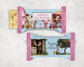Puede incluir: Barrita de arroz inflado con temática de animales de granja. El envoltorio presenta ilustraciones de dibujos animados de una vaca, una oveja, un cerdo, un pato y una niña con un perro. El texto dice "Ashley's 3rd Birthday" y "Thanks for coming!"
