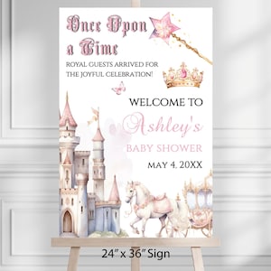 May include: A baby shower sign with a fairytale theme. The sign features a castle, horse-drawn carriage, and text that reads "Once Upon a Time" and "Welcome to Ashley's Baby Shower." The sign is 24" x 36".