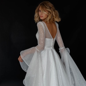 A-line glitter wedding dress with sheer sleeves PERRY| Romantic sparkly bridal gown with flared sleeves | Long sleeve princess wedding dress