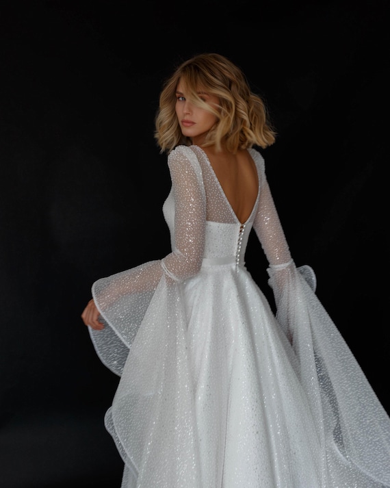 sheer sparkly wedding dress Beloved by Casablanca Bridal BL430 Delta Wedding Dress Fit And Flare V-Neck Lace Sequin Sheer Mesh Side Cut Outs Train Wedding Dress 28 / N/I