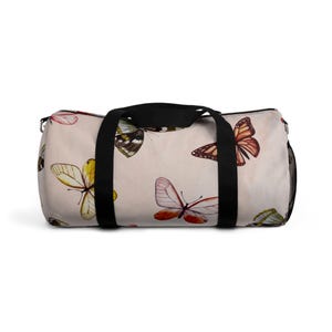 Borboletas em todas as cores com bolsa de lona com alça preta