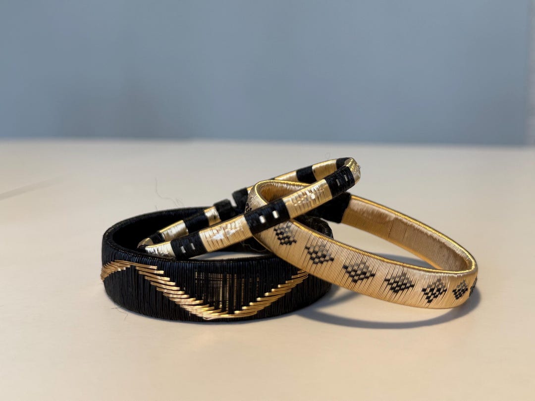 Woven Werregue gold and palm fiber bracelet stack, as listed on Etsy
