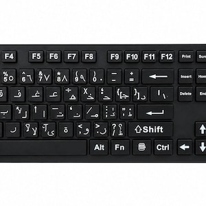 May include: A black computer keyboard featuring a standard QWERTY layout with additional Arabic script characters printed in white on each key. The device includes a full numeric keypad on the right side and the brand name LANGUAGESOURCE in the top right corner.