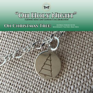 May include: A sterling silver necklace with a round pendant featuring a Christmas tree design. The pendant is 7mm wide and 35mm thick. The text "OH HOLY NIGHT" and "OH CHRISTMAS TREE" are visible.