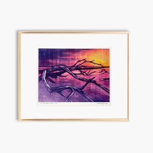 May include: A framed print of a colorful sunset over a body of water with a large, gnarled tree branch in the foreground. The print is titled "The sun before the day is out" and signed "Victoria Jeffrey".