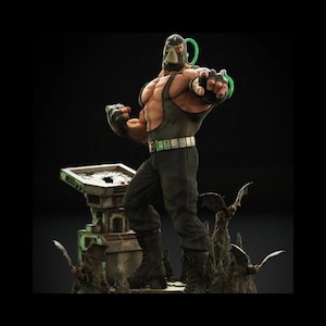 May include: A detailed figurine of the DC Comics villain Bane, posed in a dynamic stance. The figure is muscular, wearing a mask, a dark green tank top, black pants, and boots. The base features a cityscape with bat-like creatures.