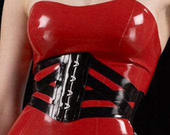May include: A red latex dress with a black corset belt. The dress is strapless and form-fitting.