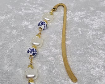 Marcador de porcelana con dije de gatito y perla