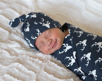 Swaddle Set Baby Boy Blanket and Top Knot Hat - Stretchy Jersey Knit Swaddle for Baby Boy or Girl - Newborn Gift Set - Bucks on Navy