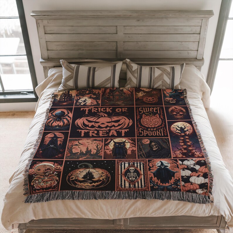 May include: A Halloween-themed throw blanket with a black background and orange and cream-colored graphics. The blanket features a pumpkin, spider, owl, and the words "Trick or Treat" and "Sweet and Spooky". The blanket is fringed.