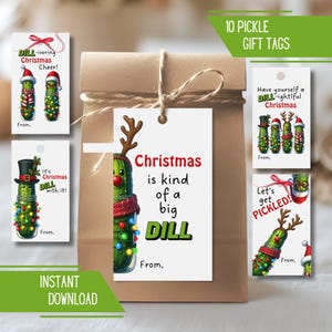 May include: A brown paper gift bag with a twine bow, featuring several Christmas-themed pickle gift tags. The tags have festive pickle illustrations with text like "Christmas is kind of a big dill."