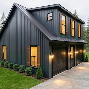 May include: A two-story, dark blue house with a black roof and wooden shutters. The house has a two-car garage and is surrounded by green grass and trees. The exterior lights are on, and the house is set in a wooded area.