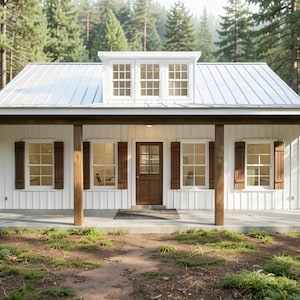 May include: A single-story house with white vertical siding, a white metal roof, and a central dormer with three windows. The front features a covered porch supported by four wooden posts, a brown wooden front door, and windows with brown shutters.