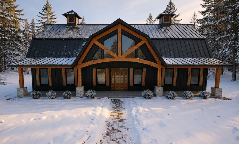 May include: A large house with black vertical siding and a dark metal roof, featuring a prominent central timber frame gable with large windows, a wooden front door, and stone pillar supports on a porch covered in light snow.