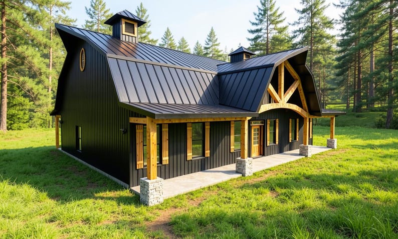 May include: A black metal-sided building with a gambrel roof, featuring natural wood support beams, stone pillar bases, and a front porch. The structure includes two small roof cupolas, an oval window, and a wooden door, set in a grassy area.